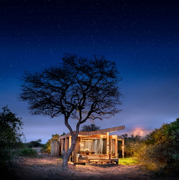 Tanzania-Grumeti-Serengeti-River-Lodge-Room-Suite-exterior-at-night
